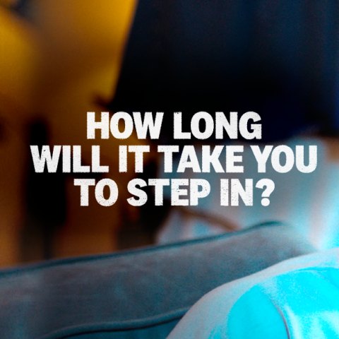 Video thumbnail showing three men on a sofa in a living room during the Mayor of London “Step In” campaign.