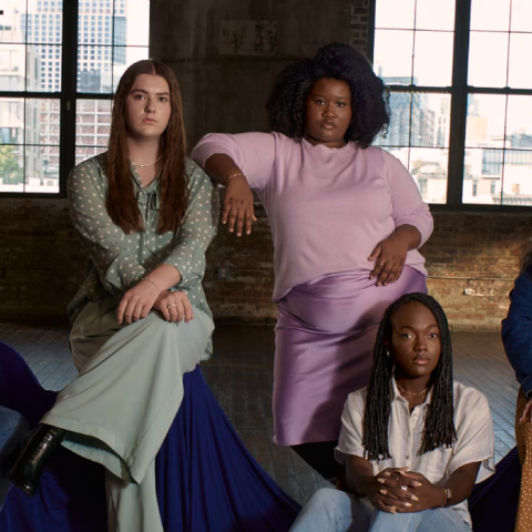 Five young women sit together confidently, representing diverse beauty in Dove’s “The Cost of Beauty” campaign.