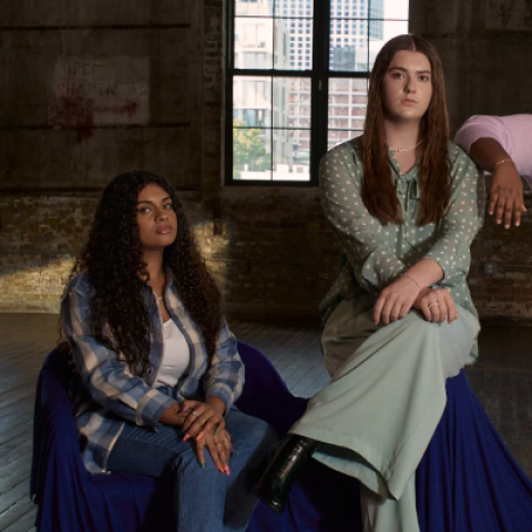 Two young women sit confidently in an industrial space as part of Dove’s “The Cost of Beauty” campaign.