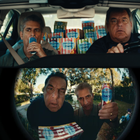 Split-screen view showing two men in a car surrounded by Sanpellegrino CIAO! packs and a close-up perspective of them holding CIAO! cans toward the camera.