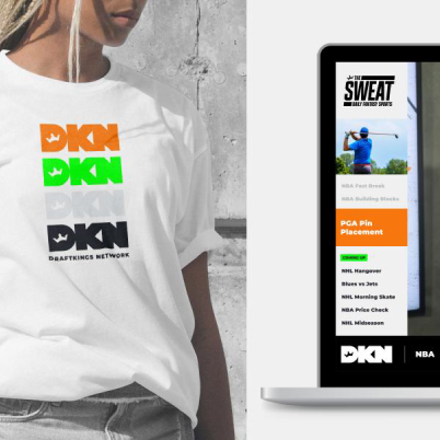 Person wearing a white DraftKings Network T-shirt featuring stacked DKN logos in orange, green, grey, and black.