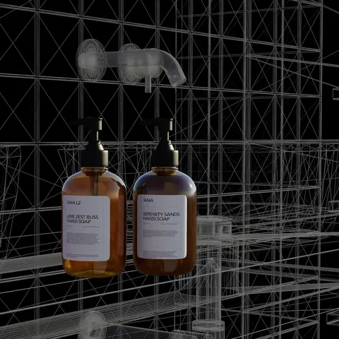 Amber hand soap bottles with pump dispensers shown in a digital wireframe interior scene